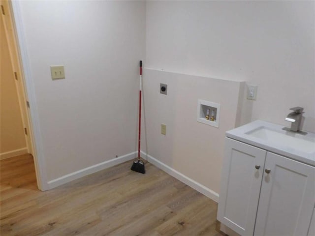 476 W Franklin St, Toccoa, GA 30577 - washroom featuring cabinet space, light wood finished floors, hookup for an electric dryer, and hookup for a washing machine
