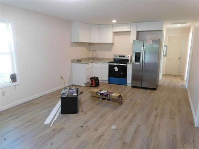 476 W Franklin St, Toccoa, GA 30577 - kitchen with stainless steel appliances, white cabinets, light wood-type flooring, and recessed lighting