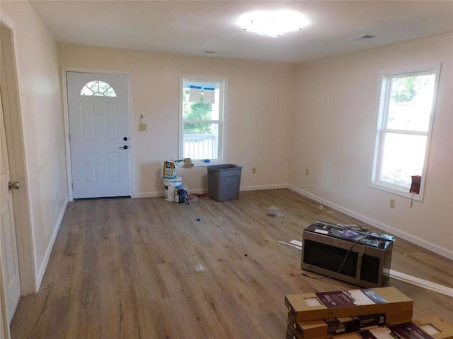 476 W Franklin St, Toccoa, GA 30577 - foyer entrance featuring healthy amount of natural light and wood finished floors