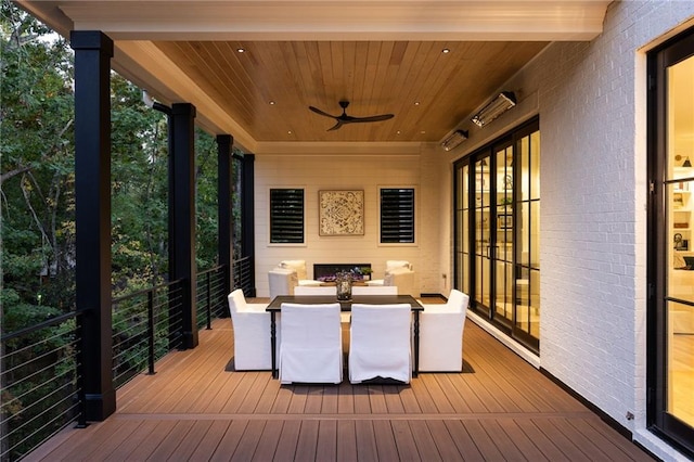 deck featuring outdoor dining space and ceiling fan