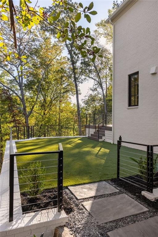 view of yard with fence and a gate