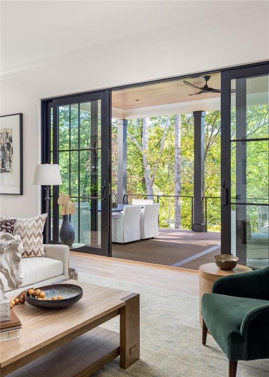 doorway featuring ceiling fan and wood finished floors