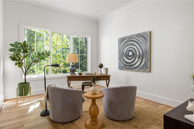 home office featuring wood finished floors, baseboards, and crown molding