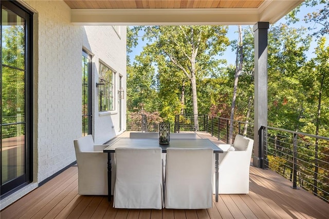 wooden deck featuring outdoor dining space