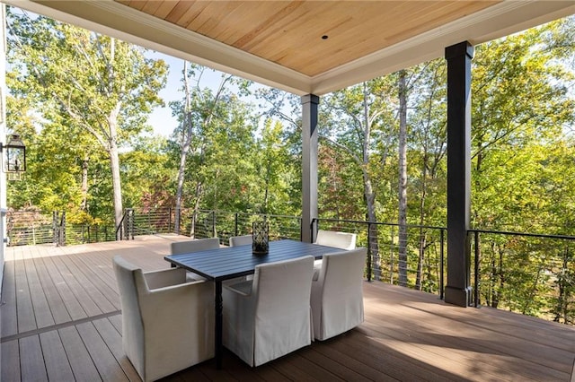 wooden terrace with outdoor dining area