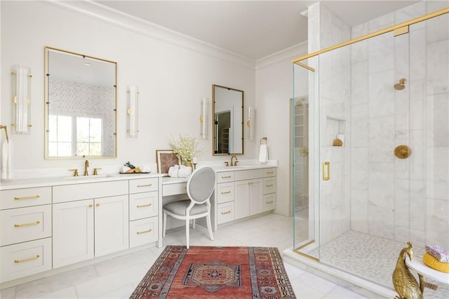 bathroom featuring a shower stall, ornamental molding, two vanities, and a sink