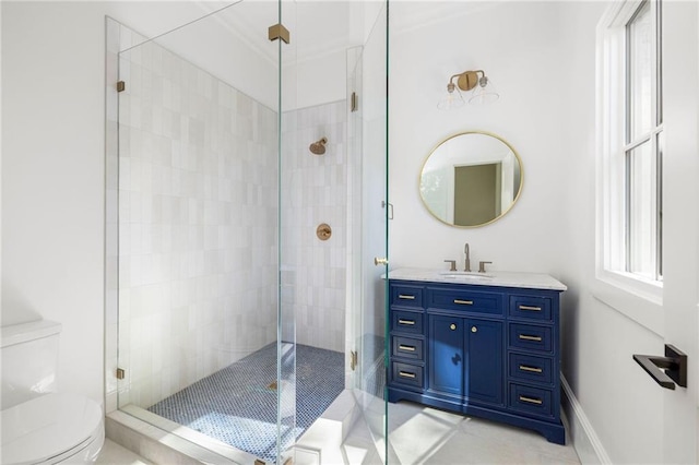 bathroom featuring baseboards, toilet, a stall shower, and vanity