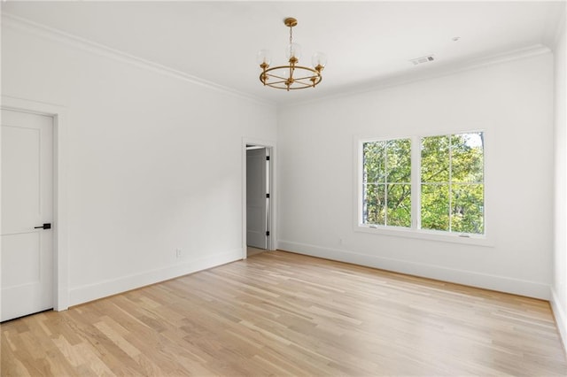 empty room featuring a chandelier, baseboards, visible vents, light wood finished floors, and crown molding