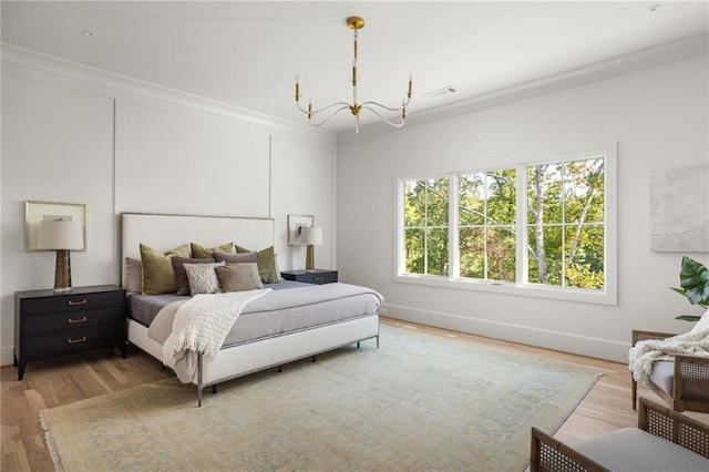 bedroom with wood finished floors, baseboards, an inviting chandelier, and visible vents