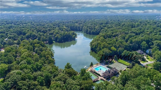 bird's eye view featuring a water view and a forest view