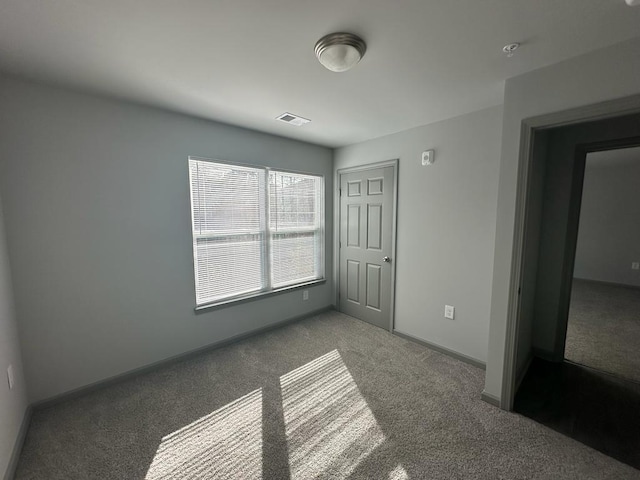 unfurnished bedroom with carpet floors