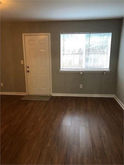 776 Crestside Ct, Austell, GA 30168 - foyer with dark wood-style flooring and baseboards