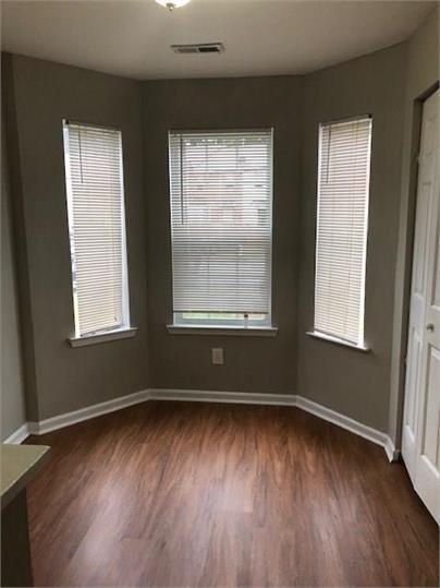 776 Crestside Ct, Austell, GA 30168 - spare room with wood finished floors and baseboards