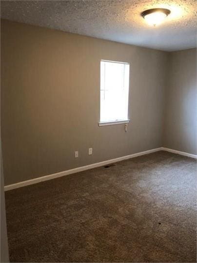 776 Crestside Ct, Austell, GA 30168 - unfurnished room with dark colored carpet and a textured ceiling