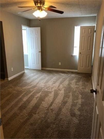 776 Crestside Ct, Austell, GA 30168 - carpeted spare room featuring plenty of natural light and a ceiling fan