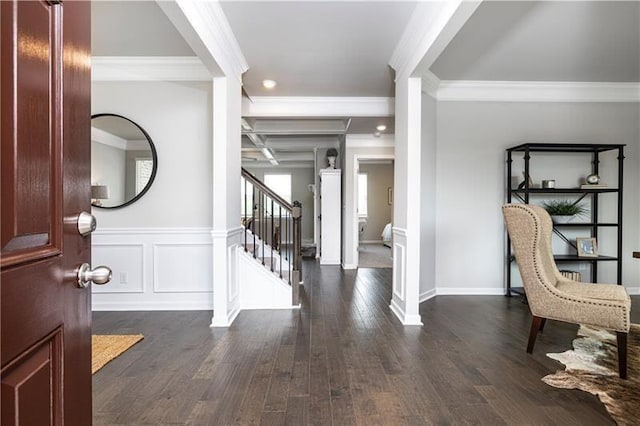 foyer with beam ceiling, dark hardwood / wood-style flooring, and ornamental molding