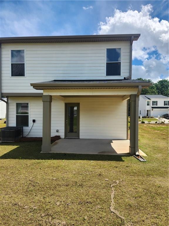 4839 Station Ln, Union City, GA 30349 - back of house featuring a patio and a lawn