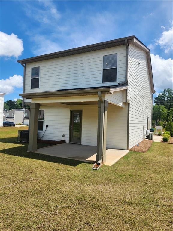 4839 Station Ln, Union City, GA 30349 - rear view of house with a patio and a lawn