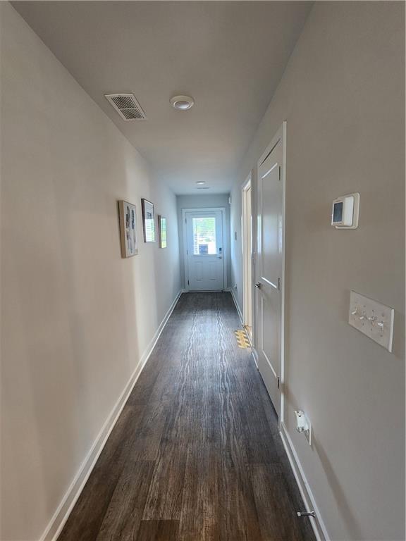 4839 Station Ln, Union City, GA 30349 - hall featuring dark wood-type flooring and baseboards