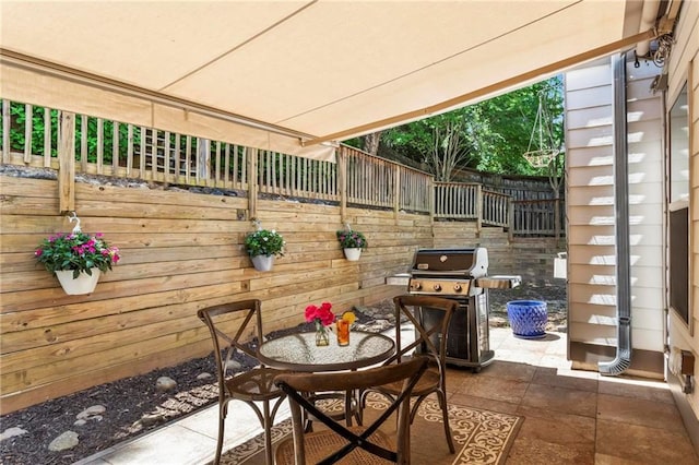 view of patio / terrace featuring fence and area for grilling