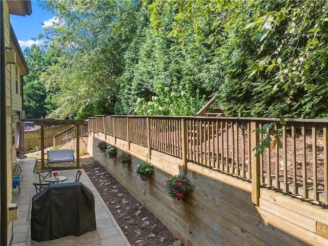 deck with fence, a patio, and area for grilling