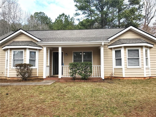 ranch-style house with a porch and a front yard