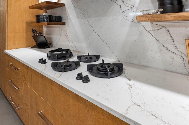 details featuring light stone countertops