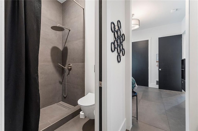 bathroom featuring walk in shower, toilet, and tile patterned flooring