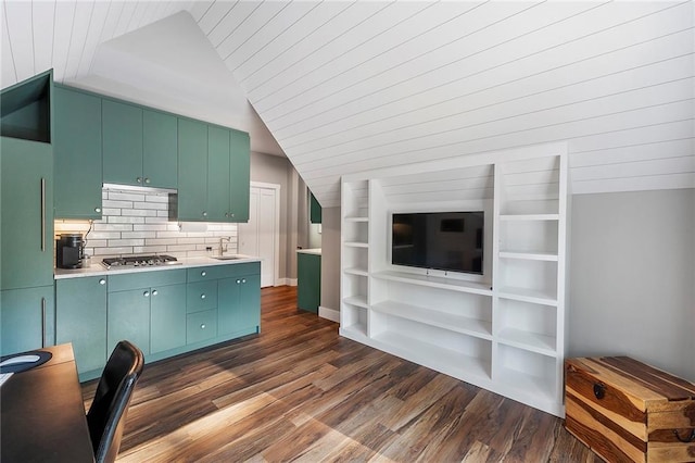 kitchen with stainless steel gas stovetop, vaulted ceiling, sink, and dark hardwood / wood-style flooring