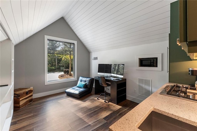 home office featuring dark wood-type flooring and vaulted ceiling