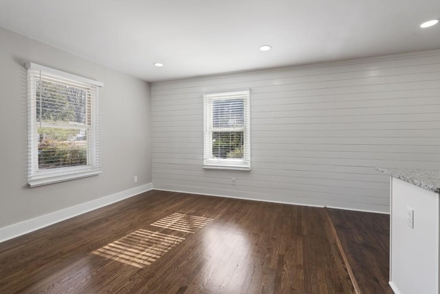 spare room featuring dark hardwood / wood-style flooring