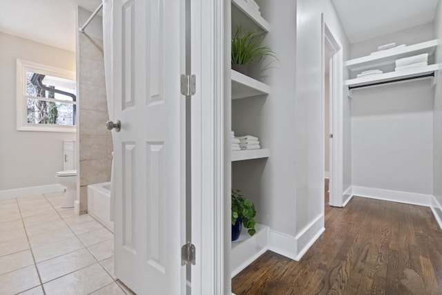 hall with light tile patterned flooring