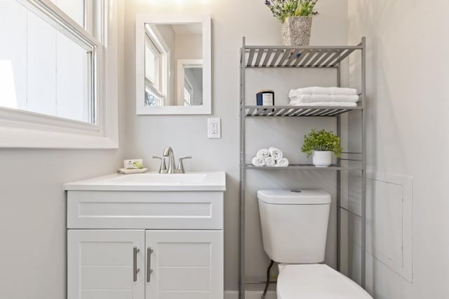 bathroom featuring vanity and toilet