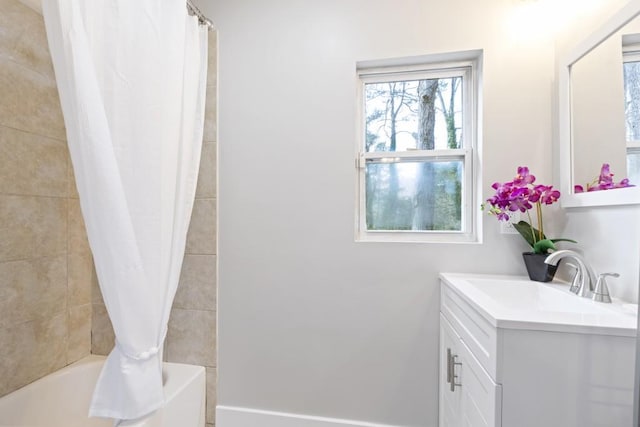 bathroom with vanity and shower / bath combo