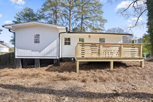 rear view of house with a wooden deck