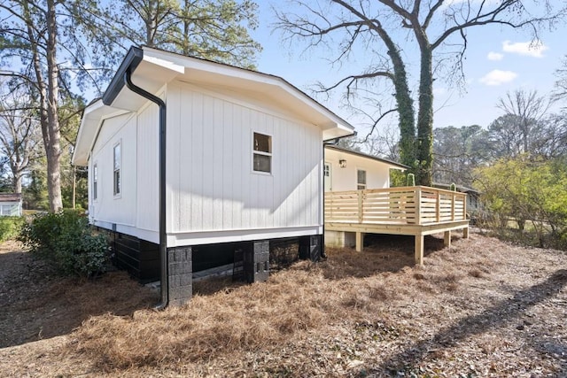 view of home's exterior featuring a deck