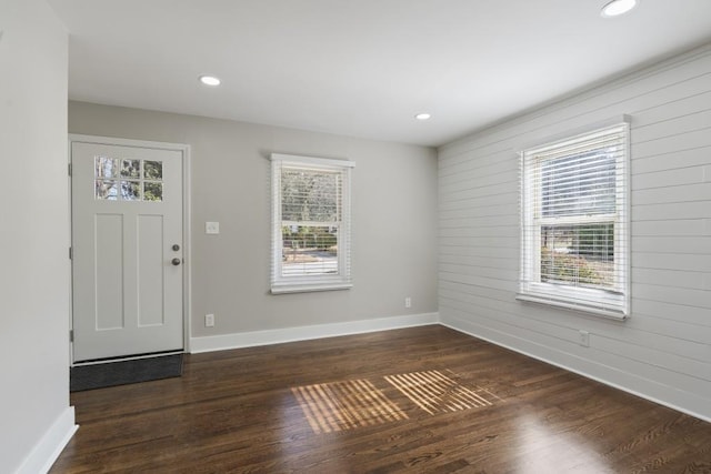 foyer entrance featuring dark wood-type flooring