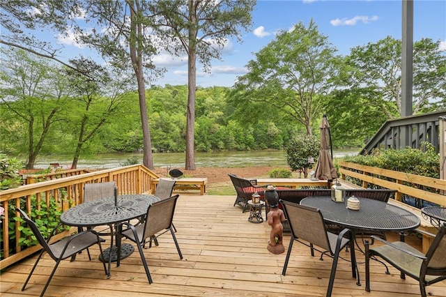 wooden deck featuring a water view