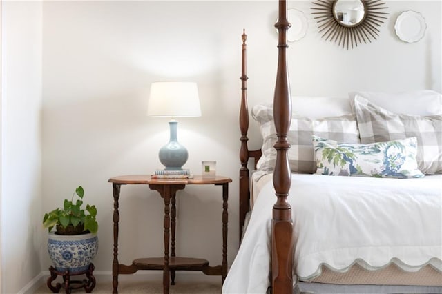 carpeted bedroom featuring baseboards