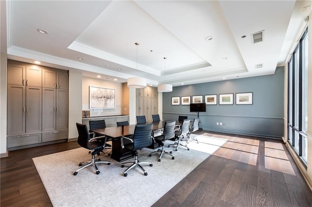 office with a tray ceiling, dark wood-type flooring, visible vents, and recessed lighting