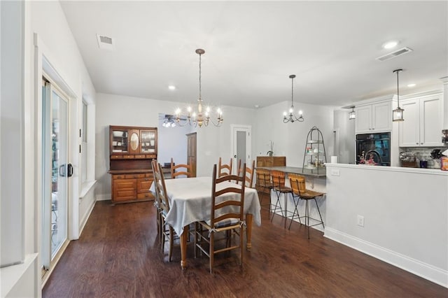 411 Johnson Rd, Locust Grove, GA 30248 - dining space with a chandelier, dark wood-type flooring, and recessed lighting
