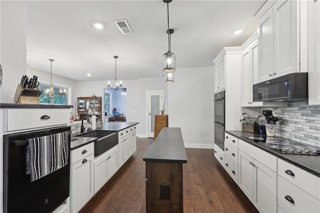411 Johnson Rd, Locust Grove, GA 30248 - kitchen featuring black appliances, dark countertops, tasteful backsplash, white cabinetry, and recessed lighting