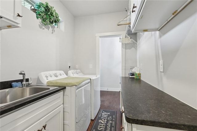 411 Johnson Rd, Locust Grove, GA 30248 - laundry room featuring independent washer and dryer, cabinet space, and dark wood-style flooring