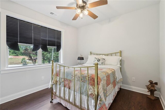411 Johnson Rd, Locust Grove, GA 30248 - bedroom featuring multiple windows, wood finished floors, and a ceiling fan