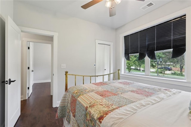 411 Johnson Rd, Locust Grove, GA 30248 - bedroom featuring wood finished floors, a ceiling fan, and a closet