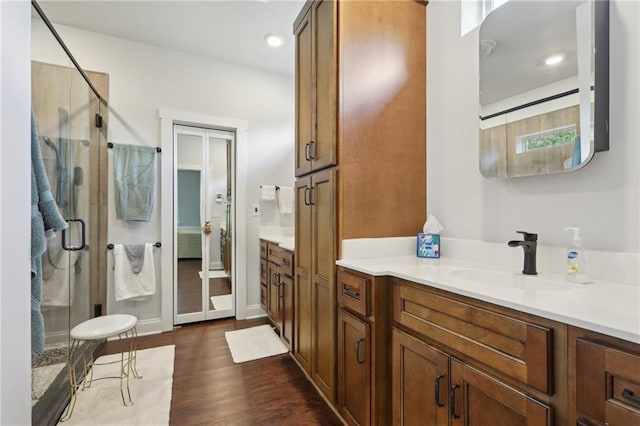 411 Johnson Rd, Locust Grove, GA 30248 - full bath with a stall shower, vanity, wood finished floors, french doors, and recessed lighting
