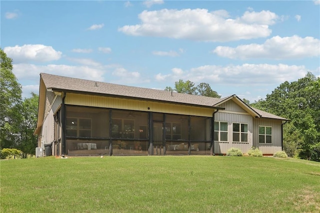 411 Johnson Rd, Locust Grove, GA 30248 - back of house featuring a lawn, a sunroom, and a shingled roof