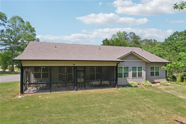 411 Johnson Rd, Locust Grove, GA 30248 - rear view of house with a sunroom, a shingled roof, and a yard