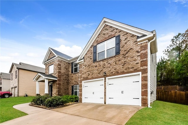 view of front of property featuring a garage and a front lawn