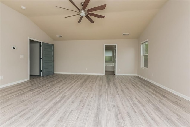 empty room with ceiling fan, lofted ceiling, and light wood-type flooring